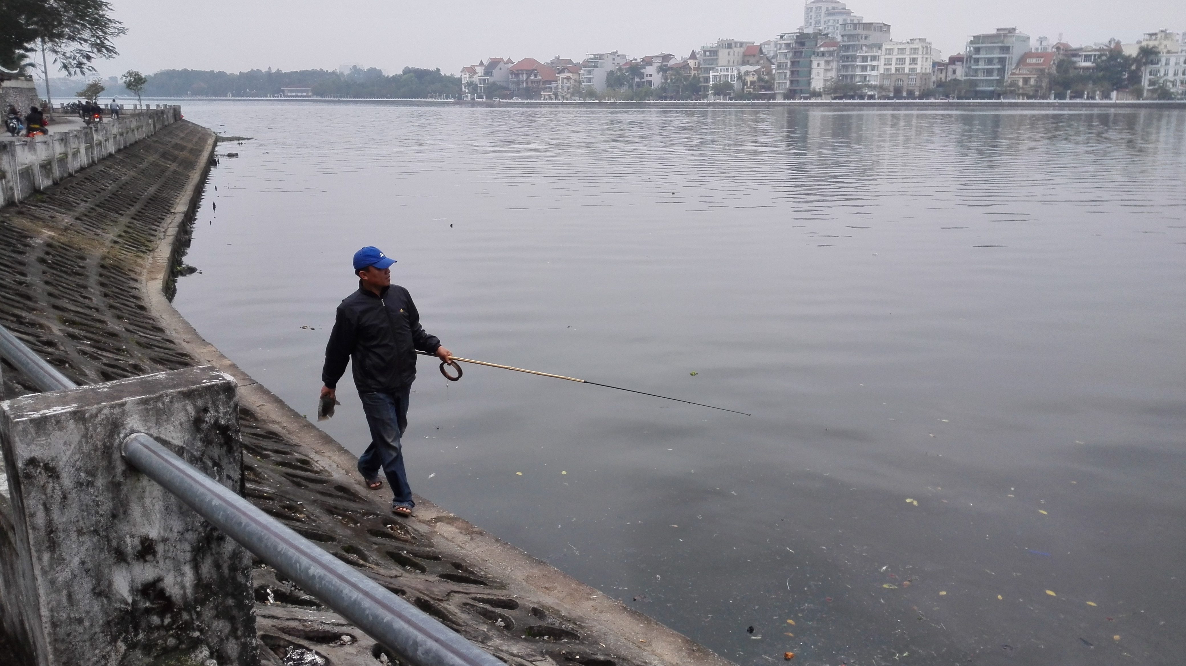 Fisherman by West Lake, Hanoi