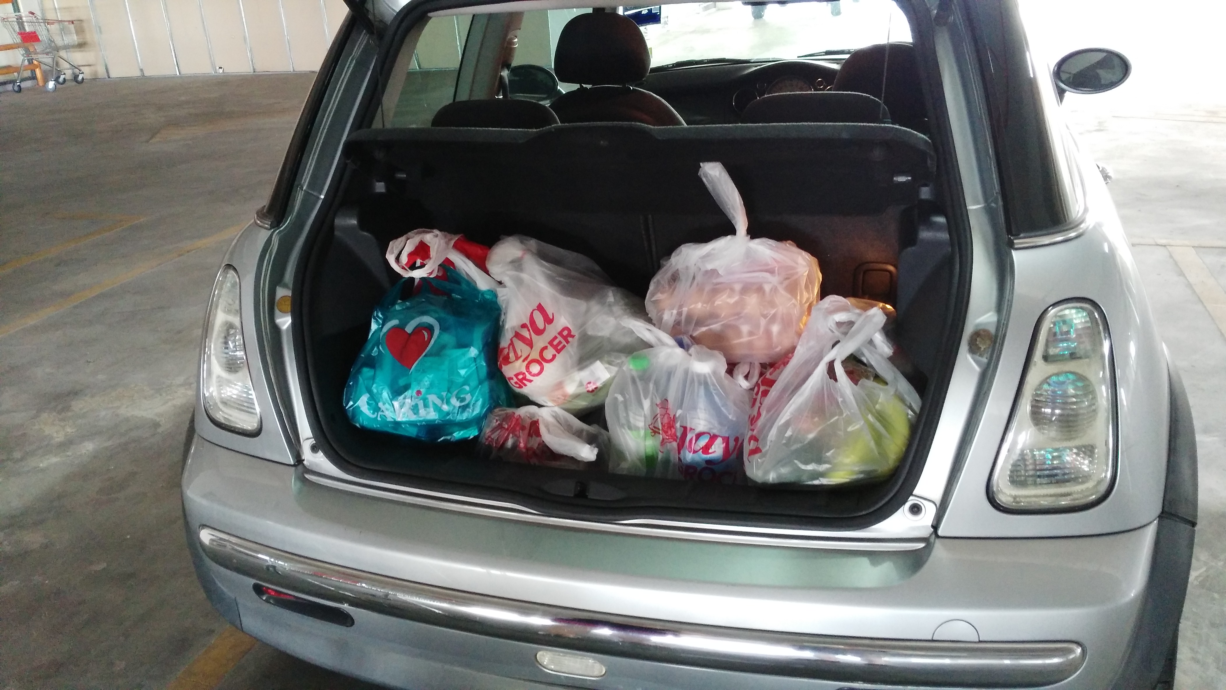 Loading up the car after going grocery shopping.